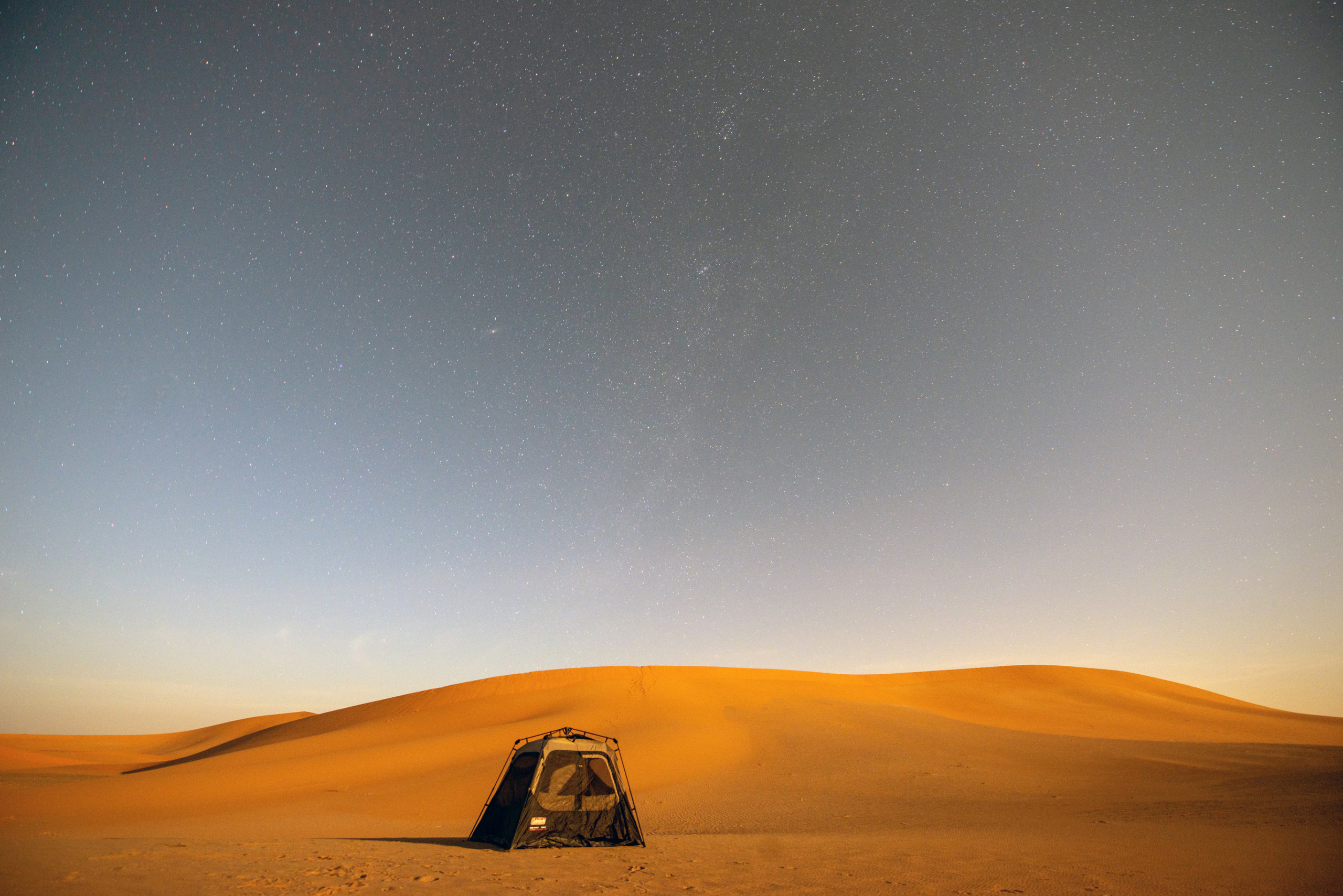 Camping tent at night in Oman
